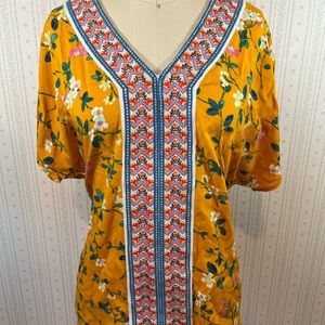 Boho style mustard yellow shirt.